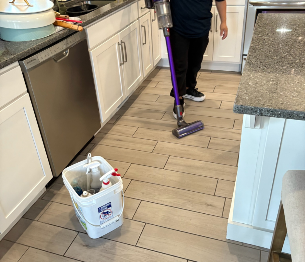Maid-Serv cleaner deep cleaning kitchen stove in Salt Lake City